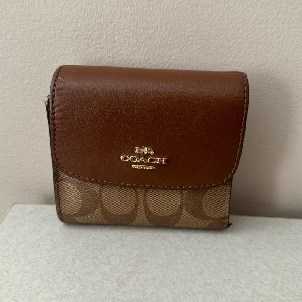 Used coach three fold wallet for women
